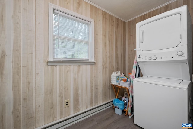 115 Circle Rd, Stanardsville, VA 22973 - clothes washing area featuring laundry area, crown molding, stacked washer and dryer, wood finished floors, and a baseboard radiator