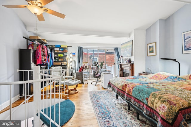 311 S American St, Philadelphia, PA 19106 - bedroom featuring wood finished floors, a desk, access to exterior, and ceiling fan