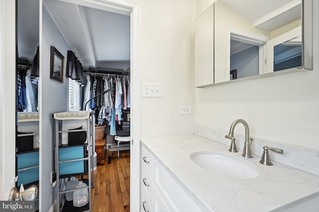 311 S American St, Philadelphia, PA 19106 - bathroom with vanity, wood finished floors, and a spacious closet