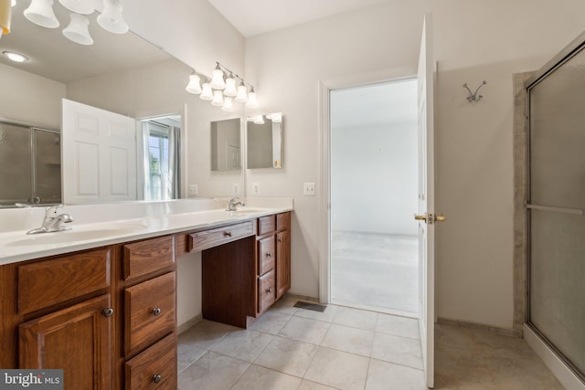 bathroom featuring tile patterned flooring, a shower with shower door, a sink, and double vanity