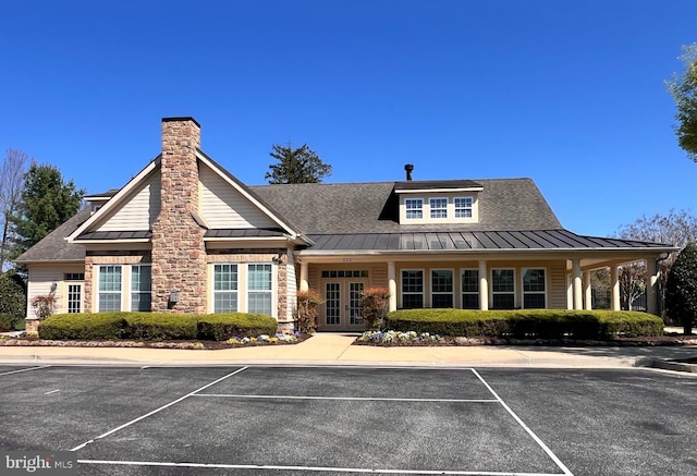 view of building exterior with uncovered parking