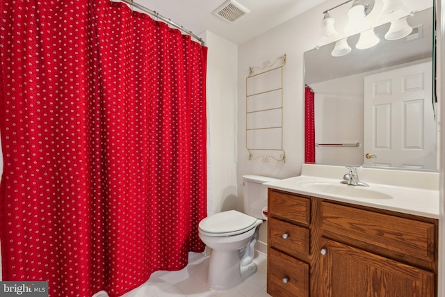 bathroom featuring visible vents, tile patterned flooring, vanity, and toilet