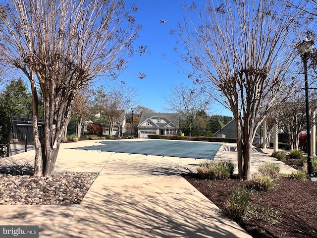 view of pool with fence