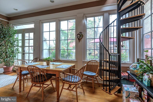 sunroom / solarium featuring french doors