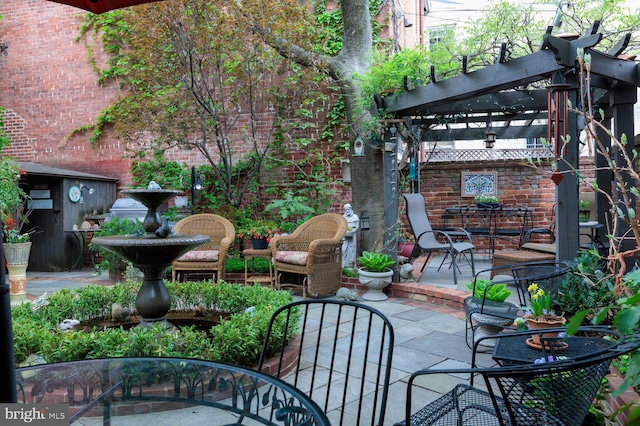 view of patio / terrace with outdoor dining space and a pergola