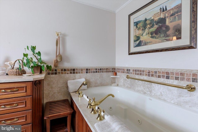 bathroom featuring crown molding and a whirlpool tub