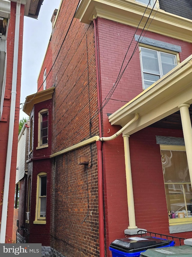 view of home's exterior with brick siding