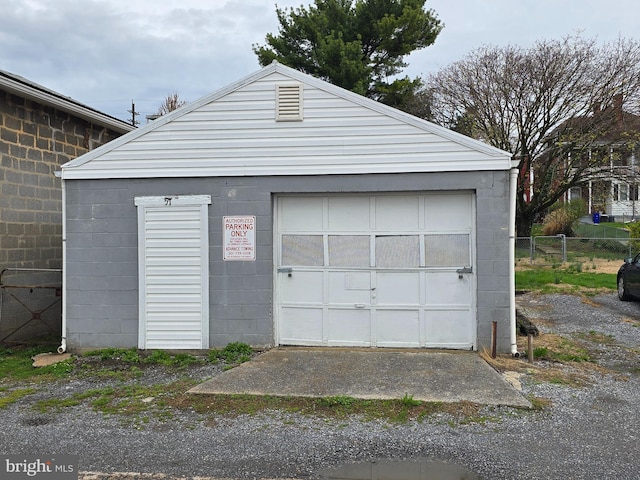 detached garage with fence