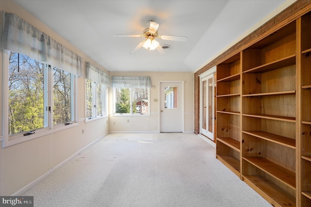 unfurnished sunroom with baseboards, carpet floors, french doors, and visible vents