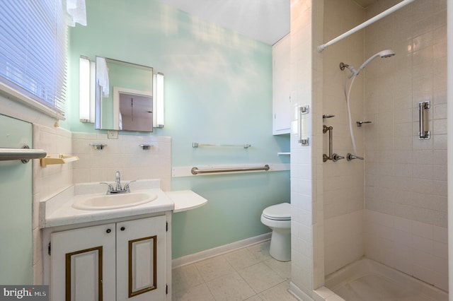 bathroom with decorative backsplash, vanity, a shower stall, and toilet