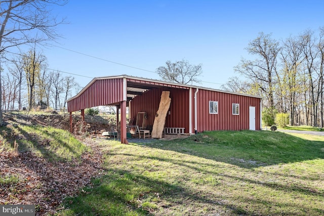 view of pole building with a yard