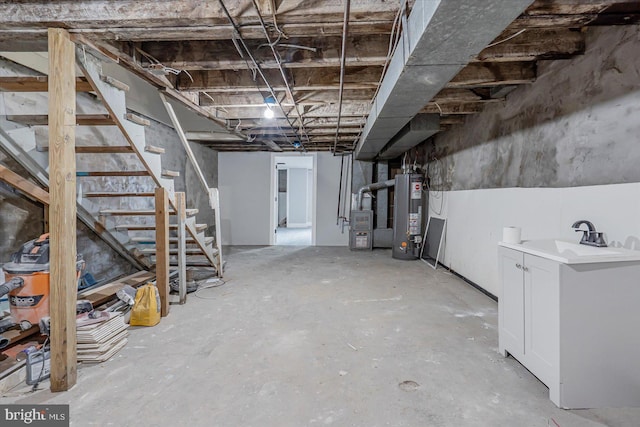 unfinished basement featuring gas water heater, stairs, a sink, and heating unit