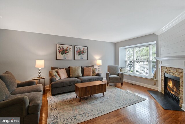 703 Harbour Ridge Ln, Downingtown, PA 19335 - living area featuring a glass covered fireplace, hardwood / wood-style flooring, and baseboards