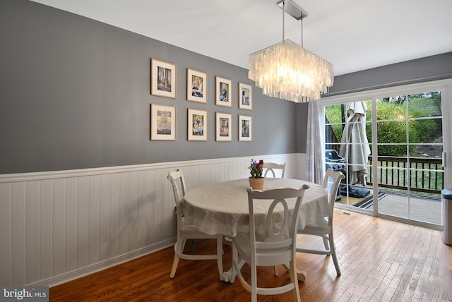 703 Harbour Ridge Ln, Downingtown, PA 19335 - dining space featuring a chandelier, hardwood / wood-style flooring, and a wainscoted wall