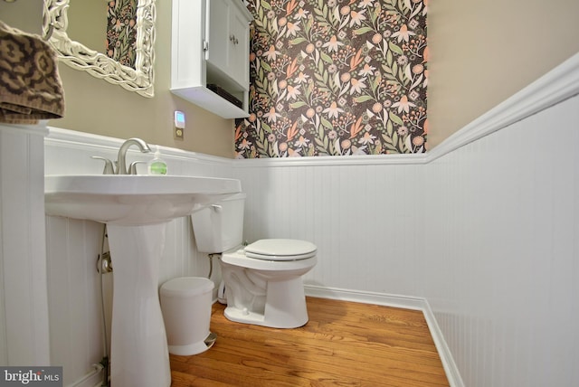 703 Harbour Ridge Ln, Downingtown, PA 19335 - bathroom with toilet, wood finished floors, and a wainscoted wall