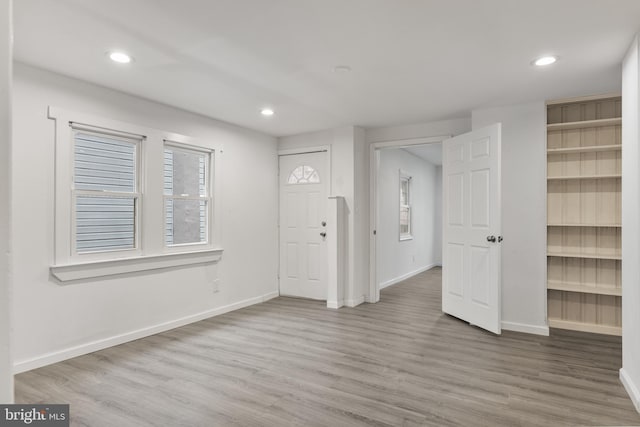 foyer entrance with baseboards, recessed lighting, and wood finished floors