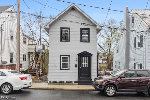 view of front of home with entry steps and stairs