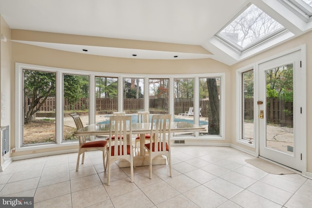 sunroom with a healthy amount of sunlight, a skylight, and french doors
