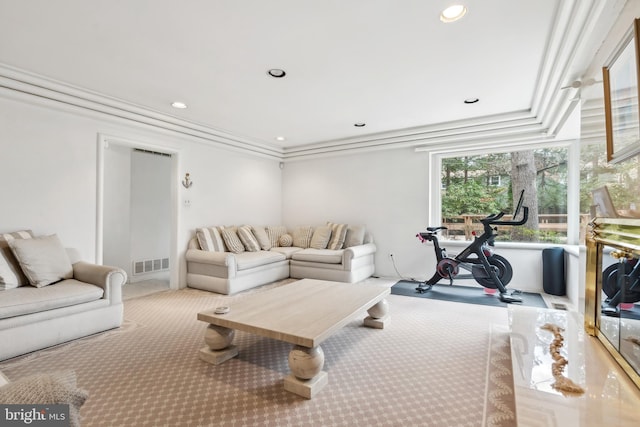 carpeted living room with crown molding, visible vents, and recessed lighting