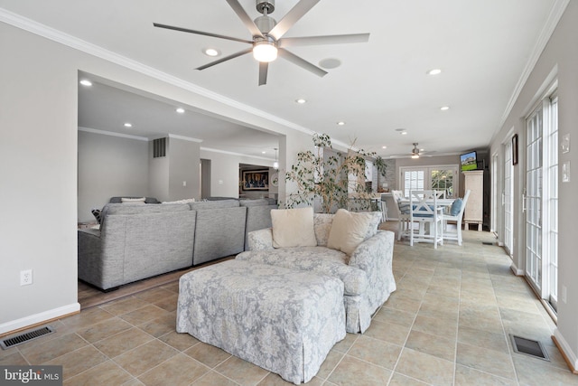 living room featuring crown molding, a ceiling fan, visible vents, and recessed lighting