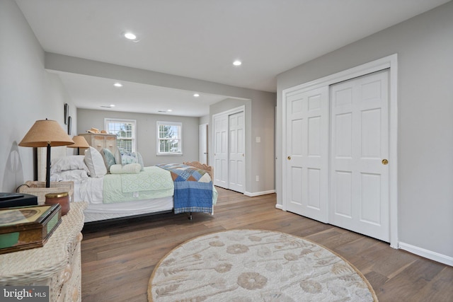 bedroom with baseboards, recessed lighting, and wood finished floors