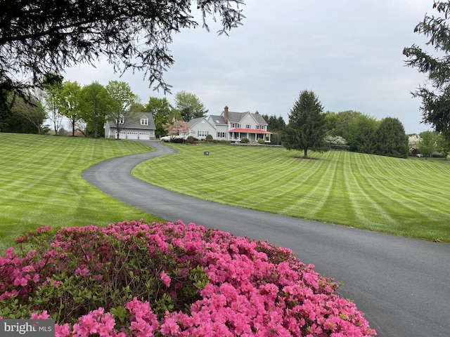 view of front of property featuring a garage and a front yard