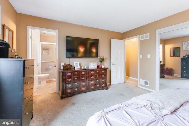 11 Solar Dr, New Providence, PA 17560 - carpeted bedroom with visible vents, baseboards, and ensuite bathroom