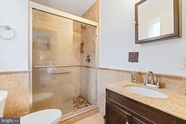 11 Solar Dr, New Providence, PA 17560 - full bathroom featuring tile walls, toilet, wainscoting, vanity, and a stall shower