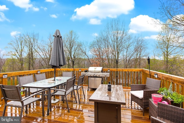 11 Solar Dr, New Providence, PA 17560 - deck with outdoor dining space, a grill, and an outdoor hangout area