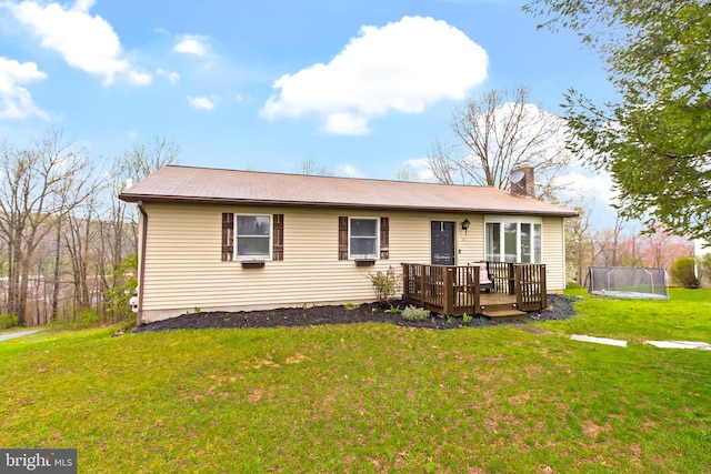 11 Solar Dr, New Providence, PA 17560 - ranch-style home featuring a trampoline, a wooden deck, a chimney, and a front lawn