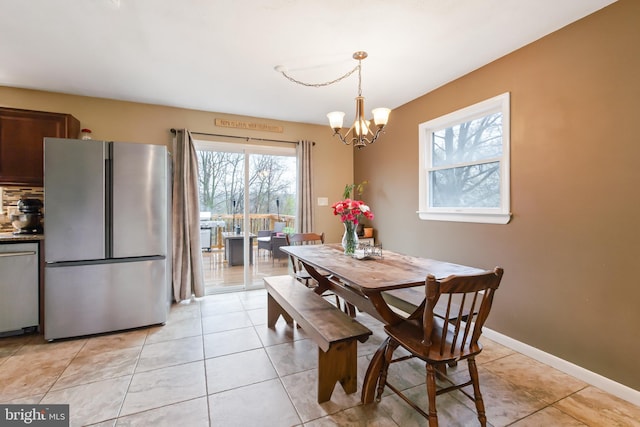 11 Solar Dr, New Providence, PA 17560 - dining room with a chandelier, light tile patterned floors, and baseboards