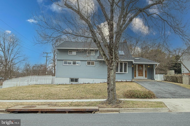 827 Crothers Ln, Rockville, MD 20852 - view of front of home with roof with shingles, driveway, a front yard, and fence