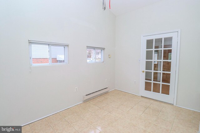 827 Crothers Ln, Rockville, MD 20852 - empty room featuring light tile patterned floors, a high ceiling, and baseboard heating