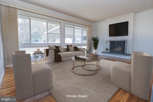 827 Crothers Ln, Rockville, MD 20852 - living area featuring a brick fireplace and wood finished floors