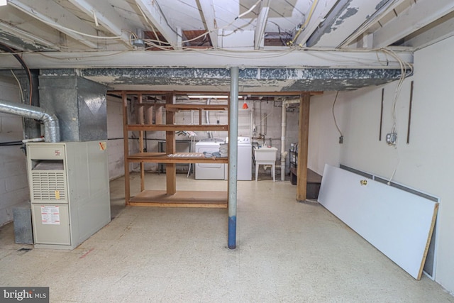827 Crothers Ln, Rockville, MD 20852 - unfinished basement with a sink, heating unit, and washer / dryer