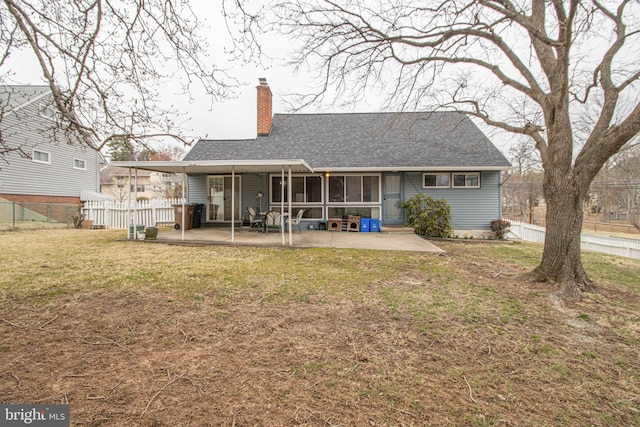 827 Crothers Ln, Rockville, MD 20852 - back of house featuring a patio, roof with shingles, a yard, and a chimney
