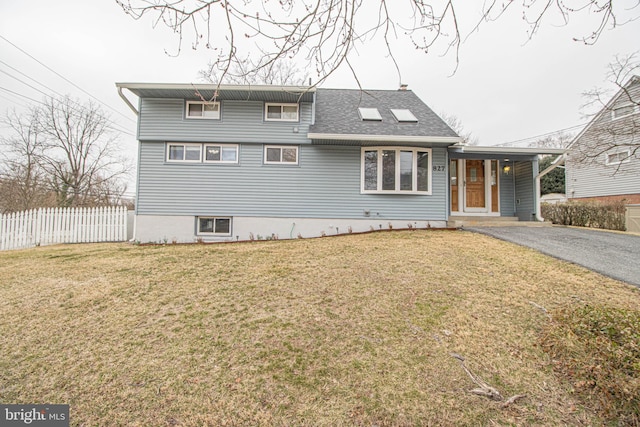 827 Crothers Ln, Rockville, MD 20852 - view of front of house with a shingled roof, fence, and a front lawn