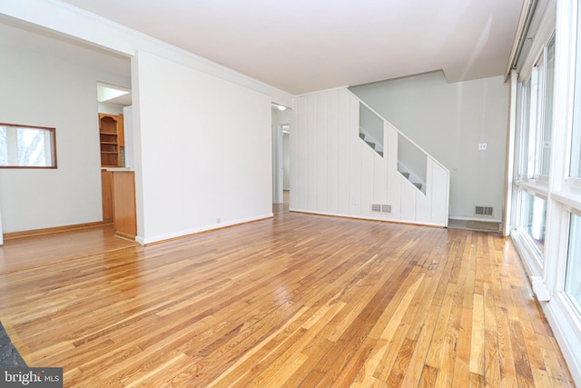 827 Crothers Ln, Rockville, MD 20852 - unfurnished living room with visible vents, plenty of natural light, and light wood-style floors