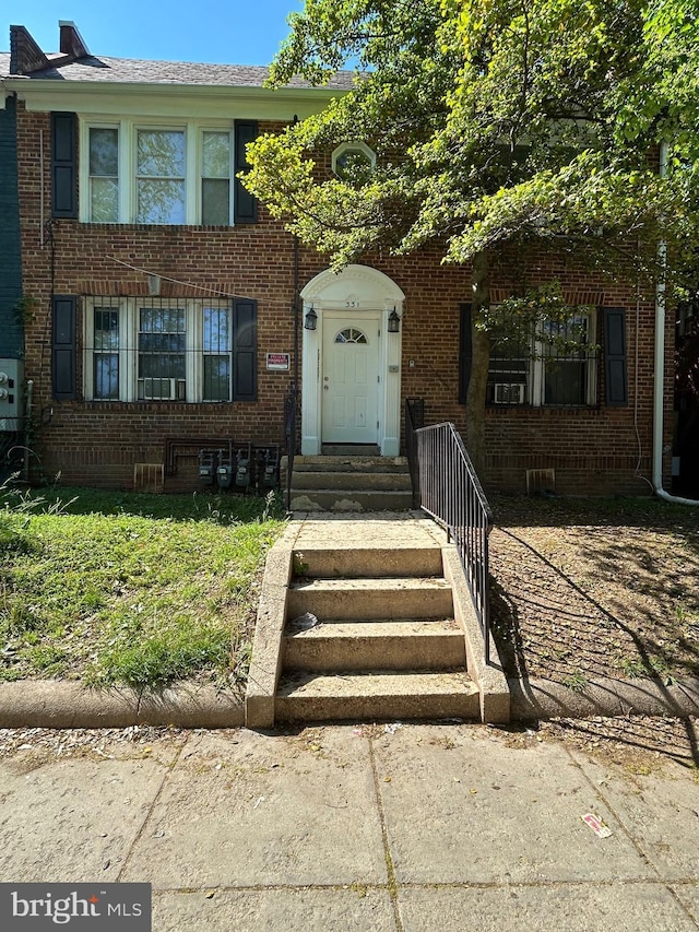 view of front of house with brick siding