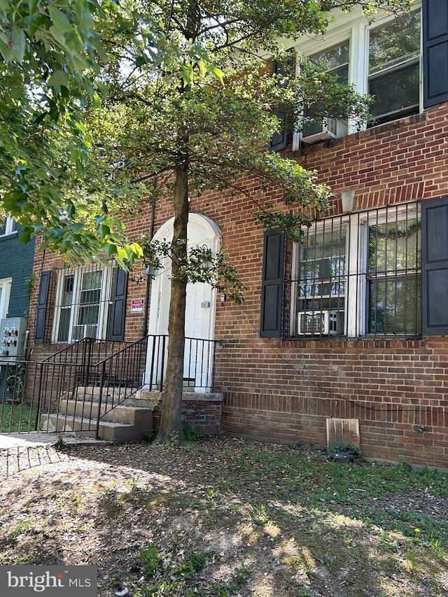view of front of house featuring brick siding