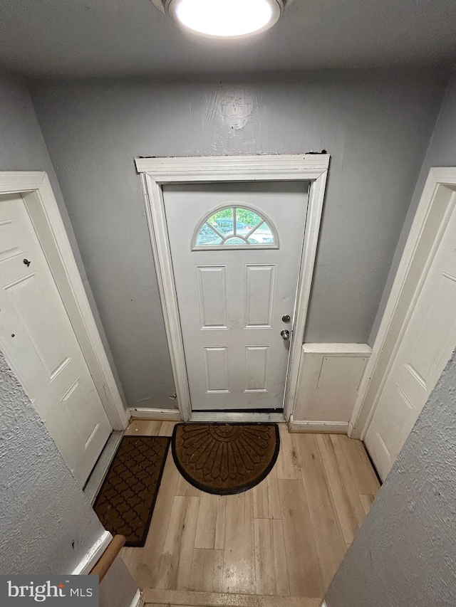 doorway to outside featuring light wood-style flooring