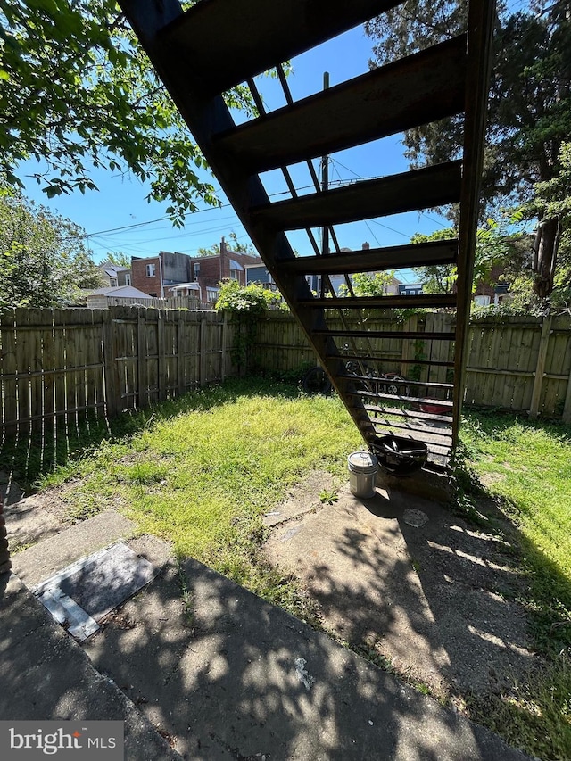 view of yard featuring a patio and a fenced backyard