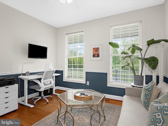 home office with baseboards, wood finished floors, and ceiling fan