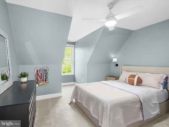 bedroom with baseboards, a ceiling fan, carpet flooring, and vaulted ceiling