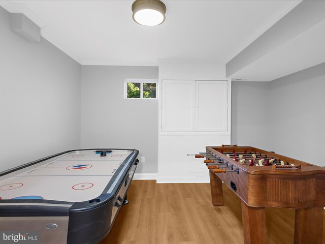 recreation room with light wood-style flooring and baseboards