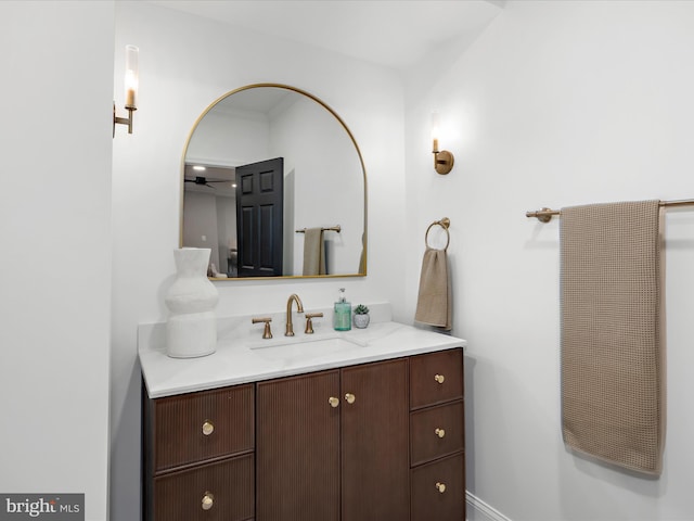 bathroom with ceiling fan and vanity