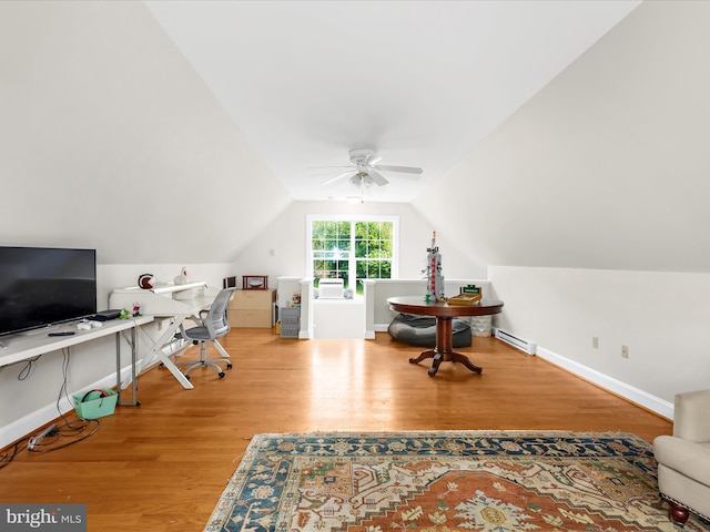office space with wood finished floors, baseboard heating, ceiling fan, baseboards, and lofted ceiling