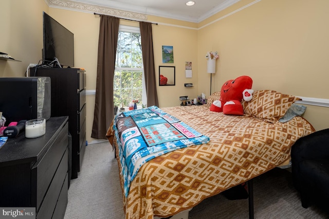 carpeted bedroom featuring ornamental molding and recessed lighting