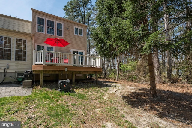 rear view of house featuring a deck