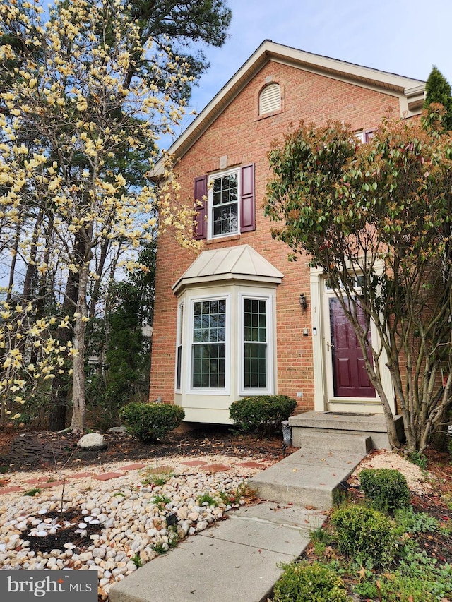 view of front of house featuring brick siding